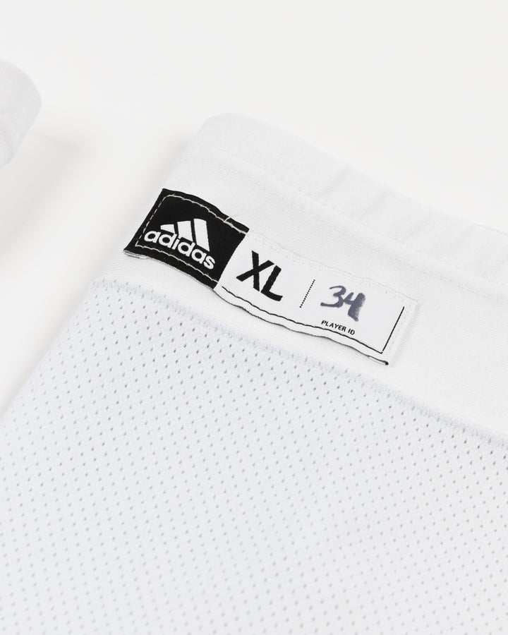 white adidas hockey socks used by Chicago Blackhawks goalie Petr Mrazek - size detail lay flat