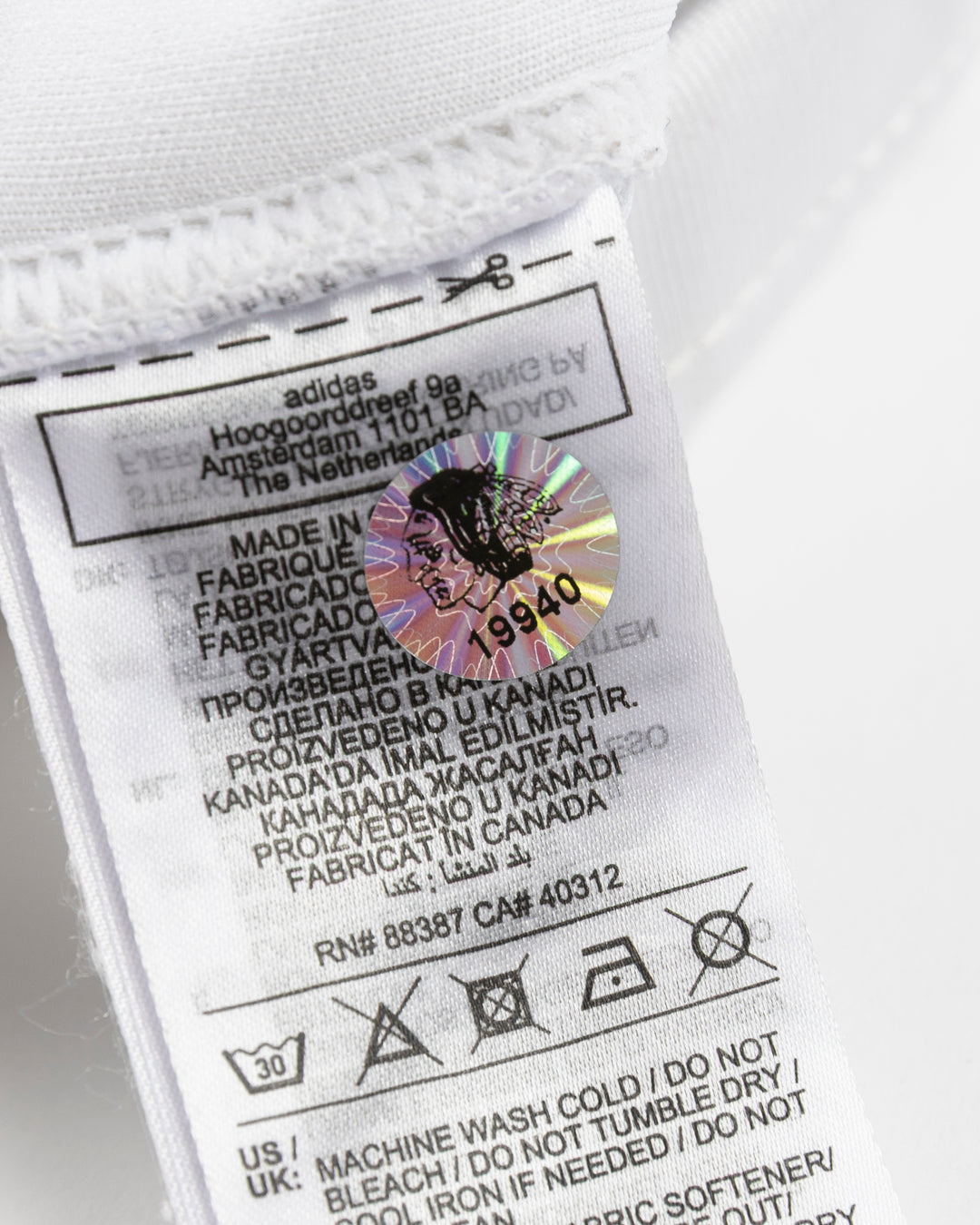 white adidas hockey socks used by Chicago Blackhawks goalie Petr Mrazek - hologram sticker detail lay flat