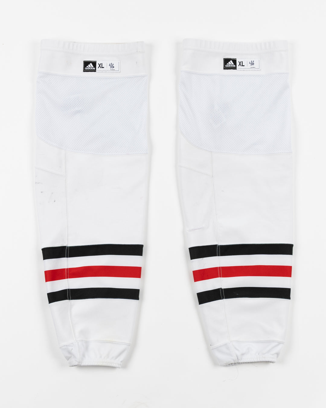 white adidas hockey socks used by Chicago Blackhawks player Louis Crevier - front lay flat
