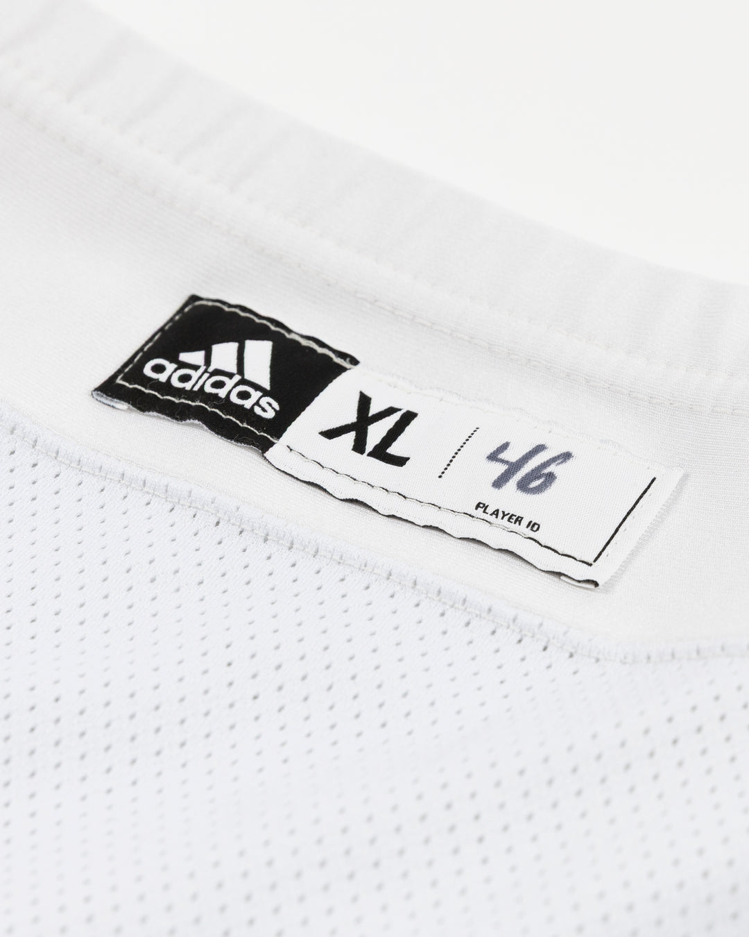 white adidas hockey socks used by Chicago Blackhawks player Louis Crevier - size tag detail lay flat