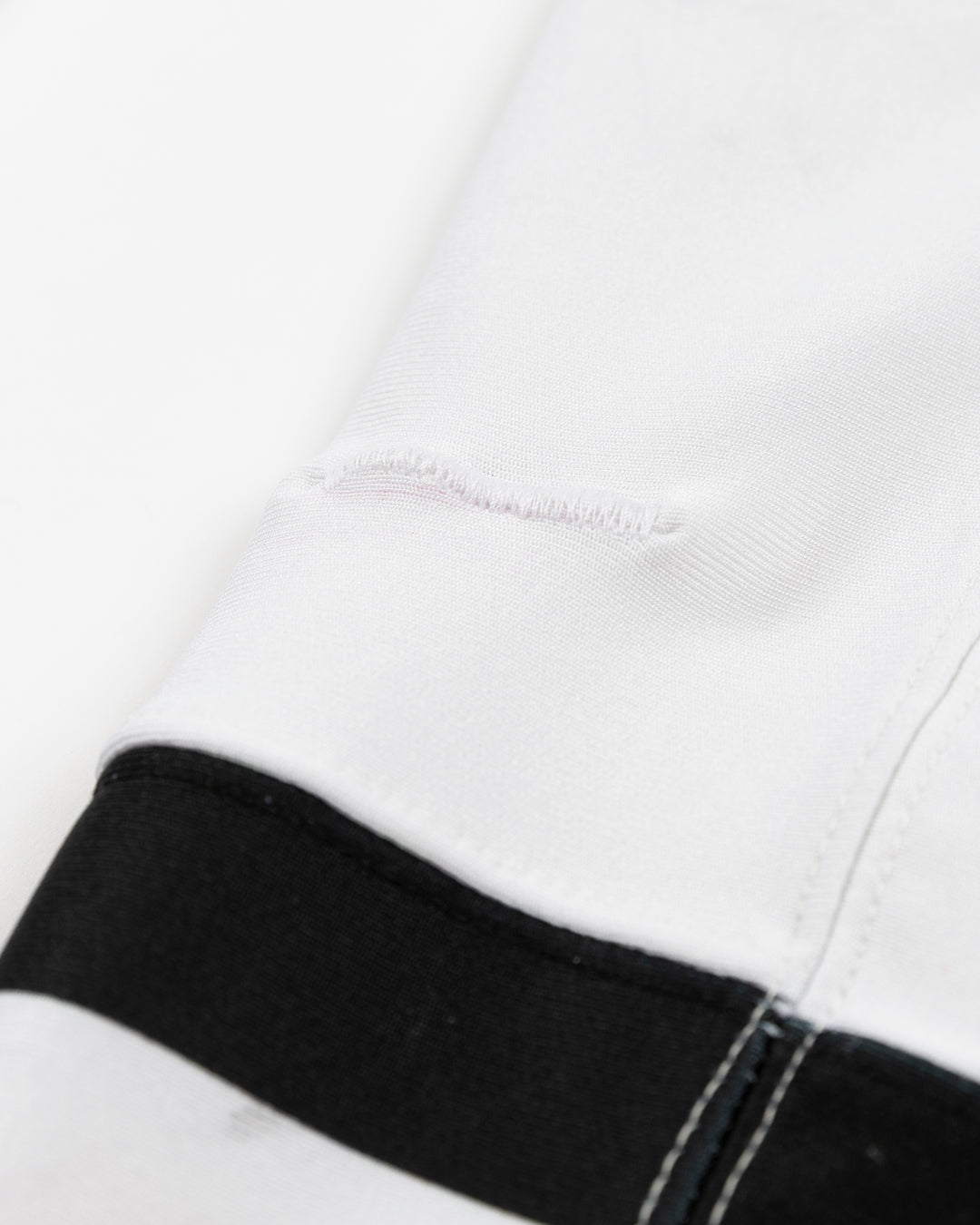 white adidas hockey socks used by Chicago Blackhawks player Louis Crevier - stitch detail lay flat