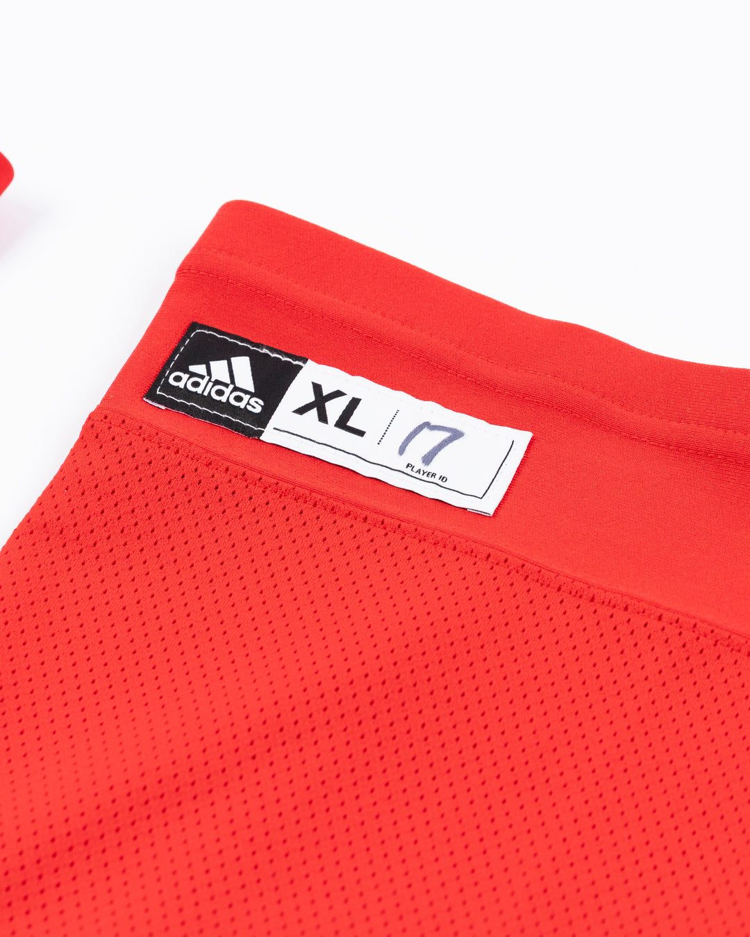 red adidas hockey socks used by Chicago Blackhawks player Nick Foligno - size tag detail lay flat