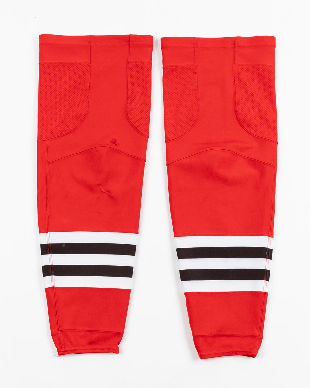 red adidas hockey socks used by Chicago Blackhawks player Nick Foligno - back lay flat