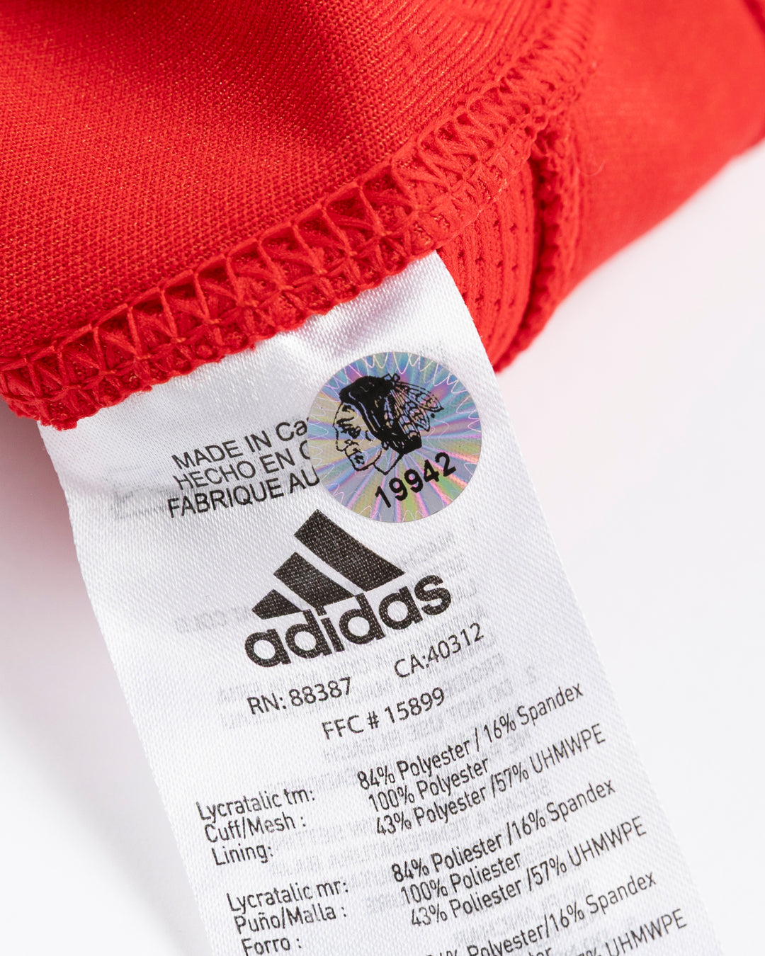 red adidas hockey socks used by Chicago Blackhawks player Nick Foligno - hologram sticker lay flat