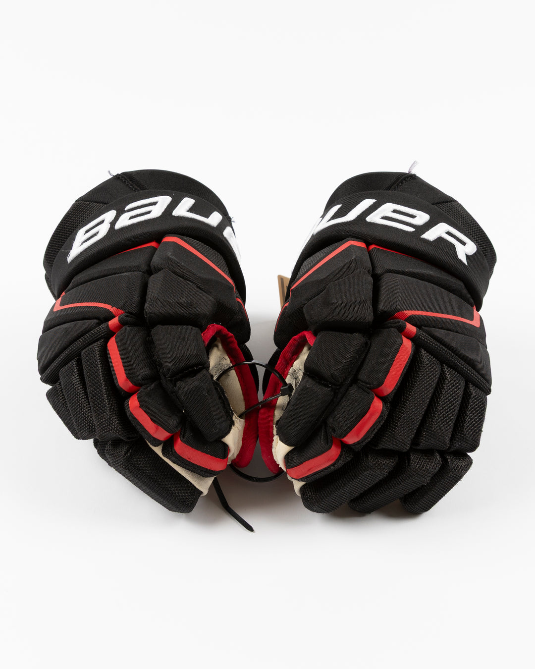 black Bauer hockey gloves used by Chicago Blackhawks player Craig Smith - front lay flat