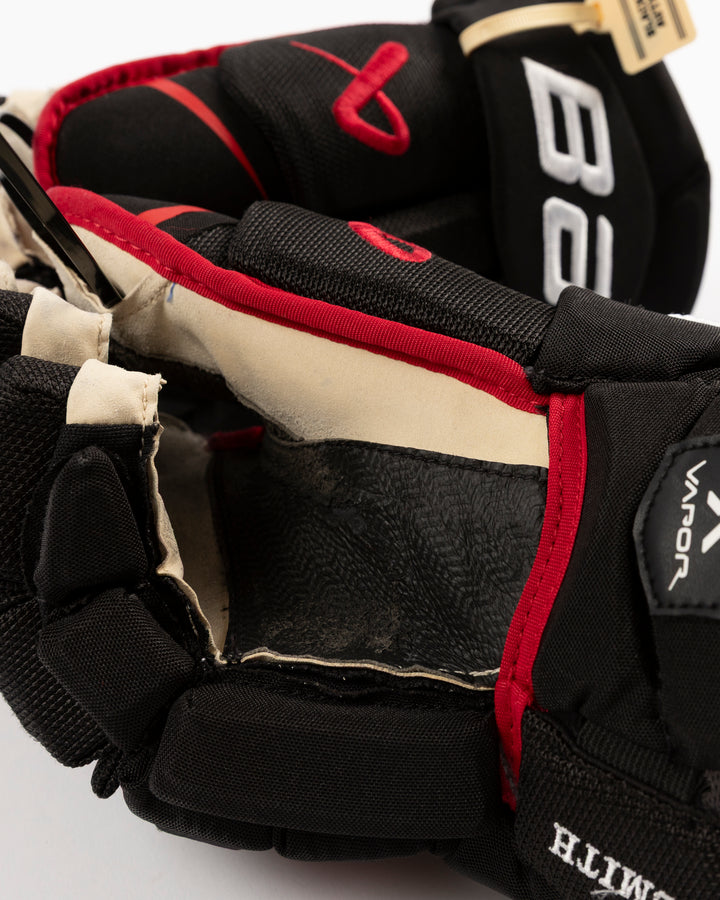 black Bauer hockey gloves used by Chicago Blackhawks player Craig Smith - palm detail lay flat