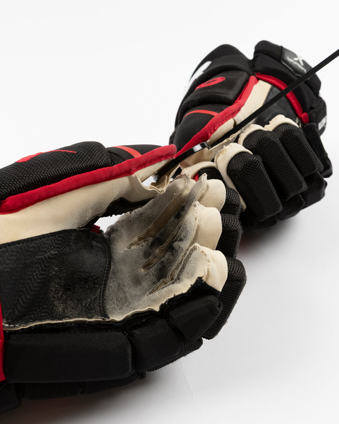 black Bauer hockey gloves used by Chicago Blackhawks player Craig Smith - scuff detail lay flat