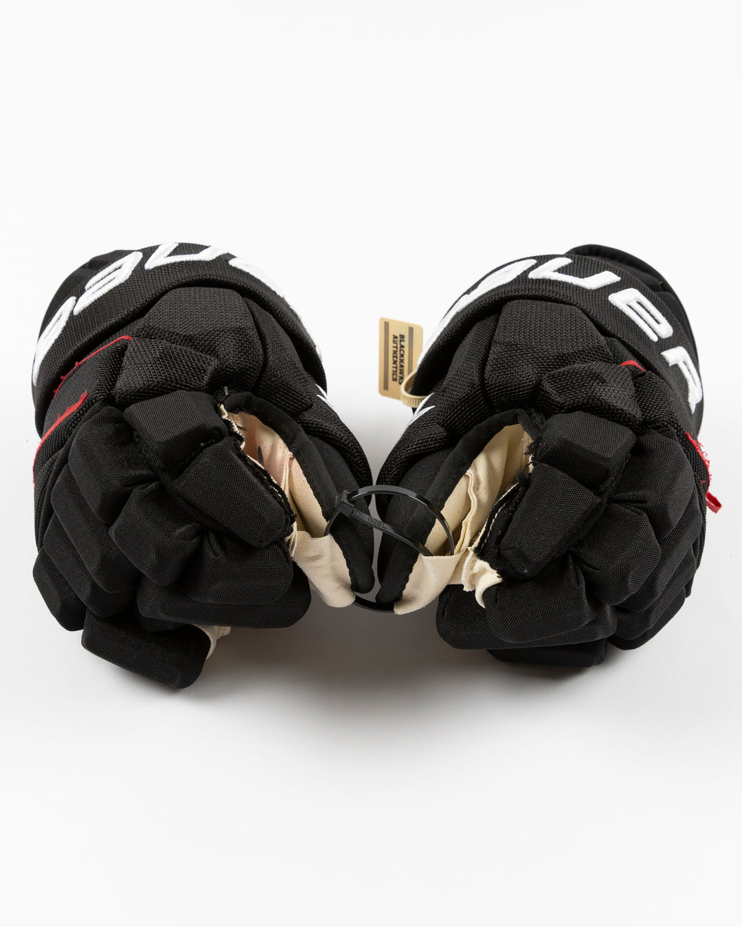 black Bauer hockey gloves used by Chicago Blackhawks player Taylor Hall - front lay flat