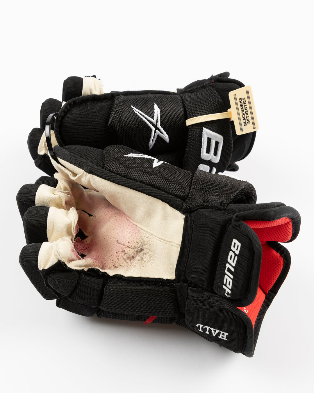 black Bauer hockey gloves used by Chicago Blackhawks player Taylor Hall - palm detail lay flat