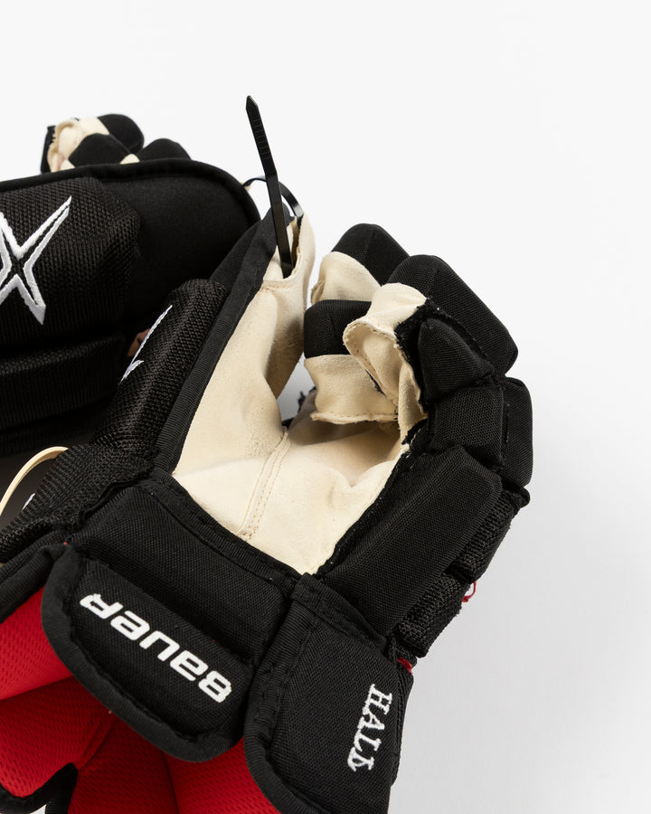 black Bauer hockey gloves used by Chicago Blackhawks player Taylor Hall - alt detail lay flat