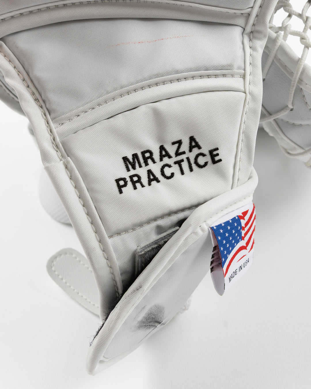 white and red Vaughn hockey goalie glove used by Chicago Blackhawks goalie Petr Mrazek - name detail lay flat