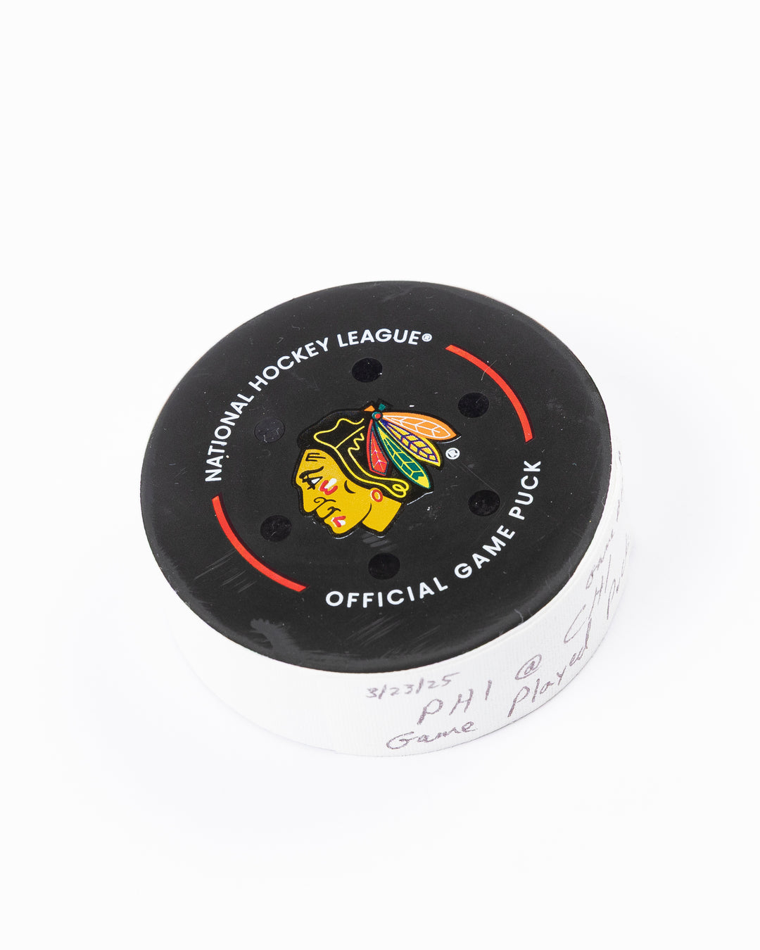official Chicago Blackhawks hockey puck used in game against Philadelphia Flyers on 3/23/25 - front angle lay flat