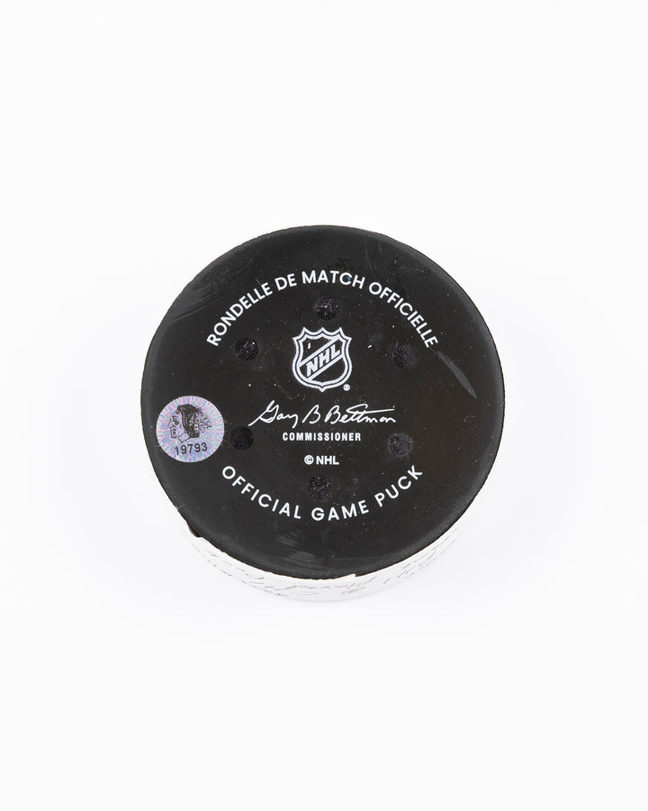official Chicago Blackhawks hockey puck used in game against Philadelphia Flyers on 3/23/25 - back lay flat