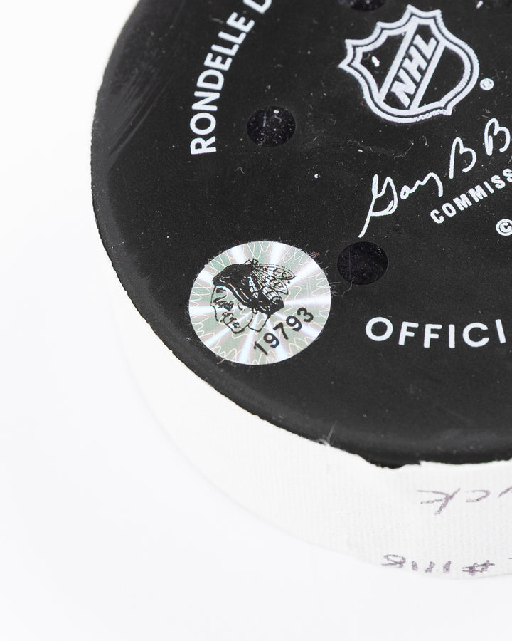 official Chicago Blackhawks hockey puck used in game against Philadelphia Flyers on 3/23/25 - hologram sticker detail lay flat