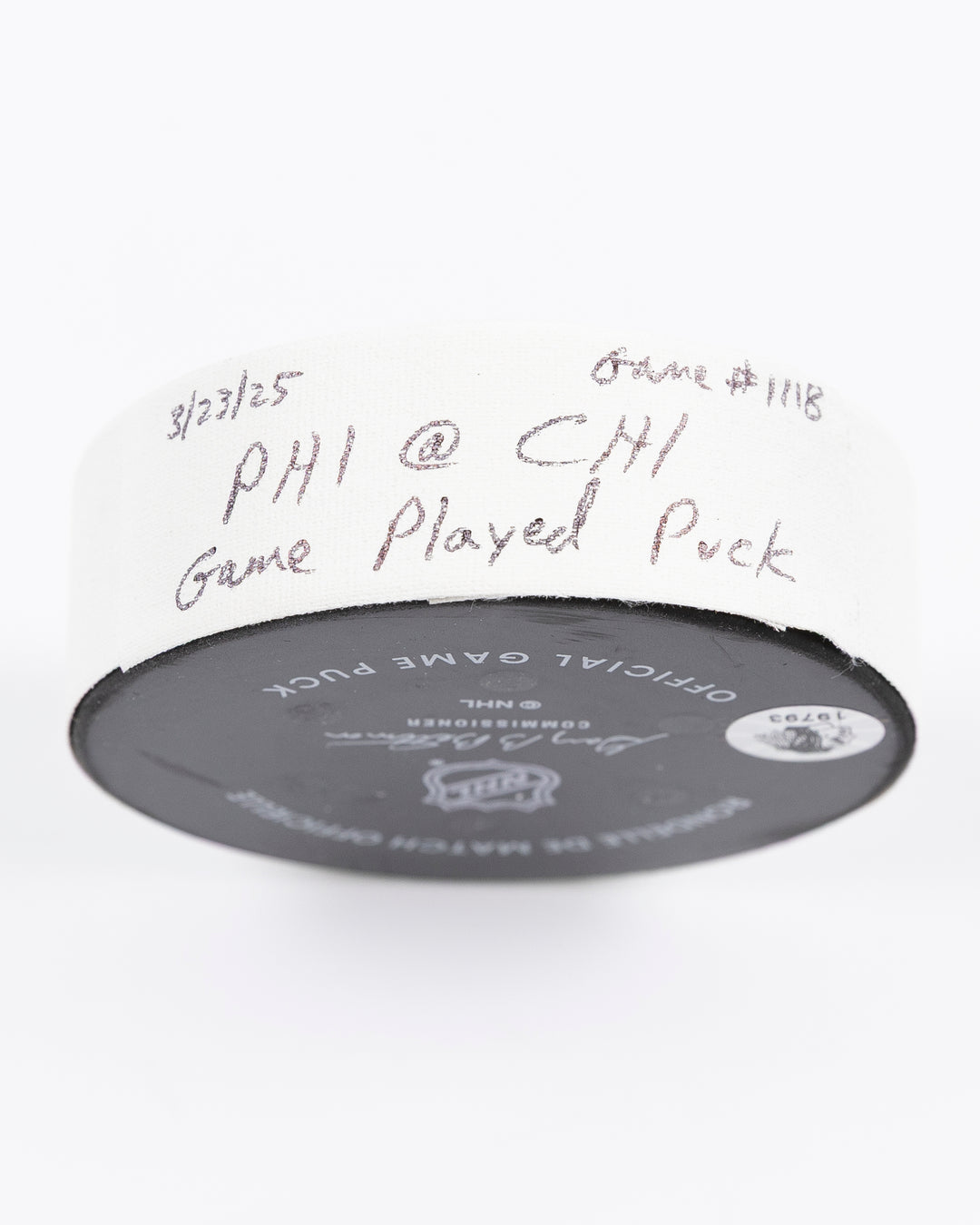 official Chicago Blackhawks hockey puck used in game against Philadelphia Flyers on 3/23/25 - tape detail lay flat
