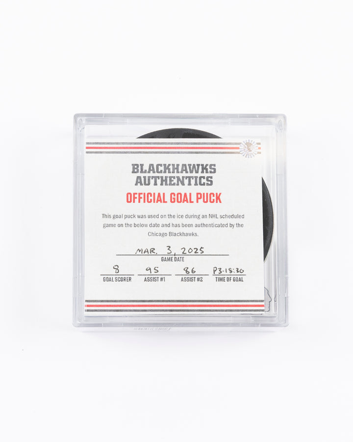 official game used goal puck scored by Chicago Blackhawks player Ryan Donato - front lay flat in case with certificate