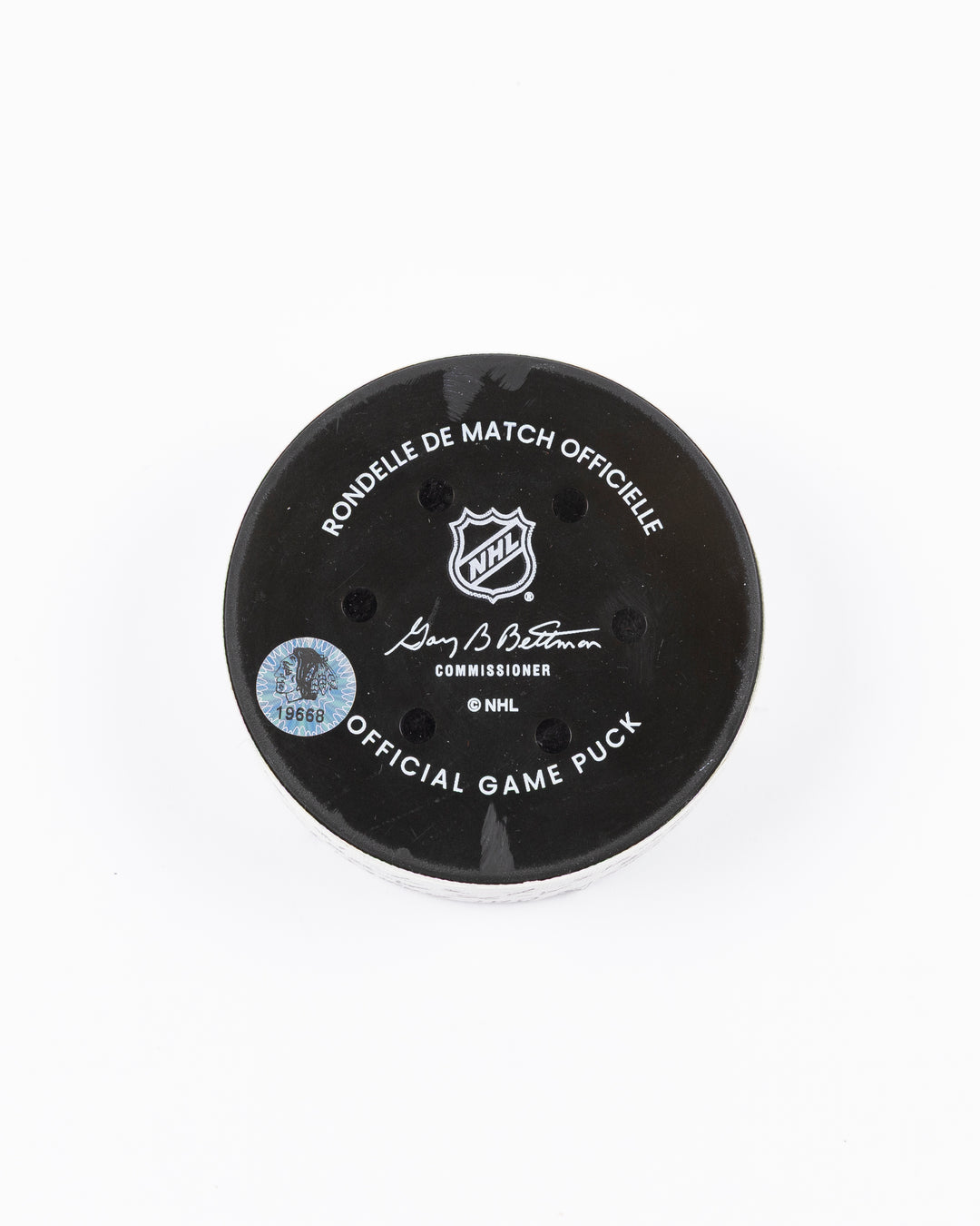 official game used goal puck scored by Chicago Blackhawks player Ryan Donato - back lay flat