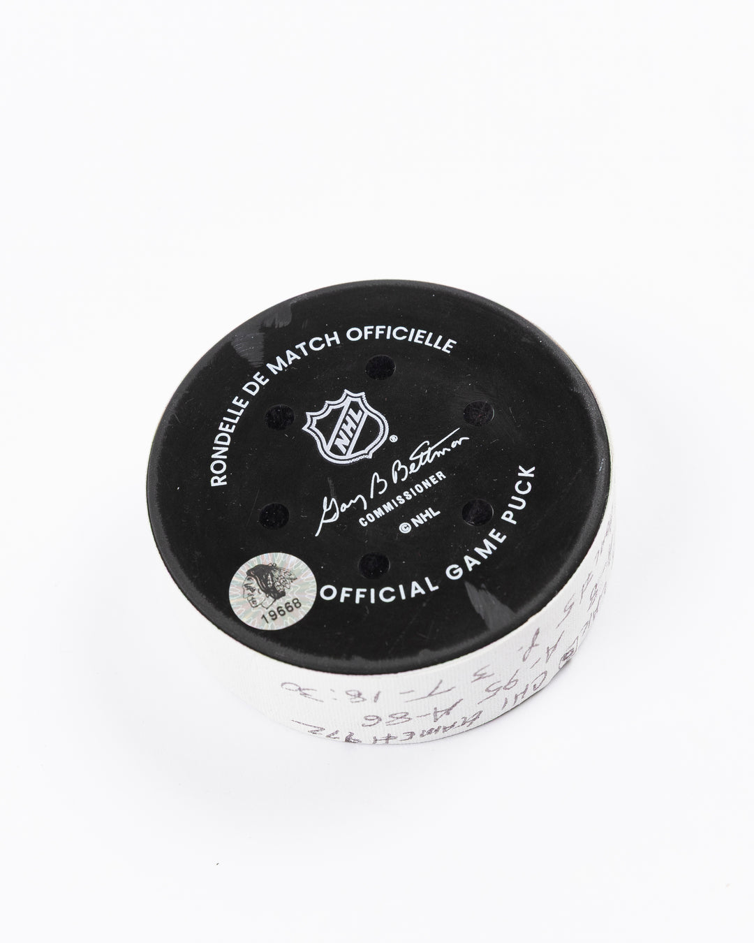 official game used goal puck scored by Chicago Blackhawks player Ryan Donato - back angle lay flat