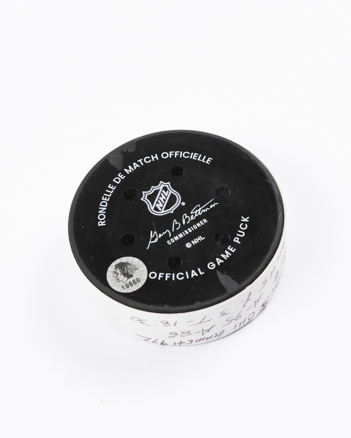 official game used goal puck scored by Chicago Blackhawks player Ryan Donato - back angle lay flat