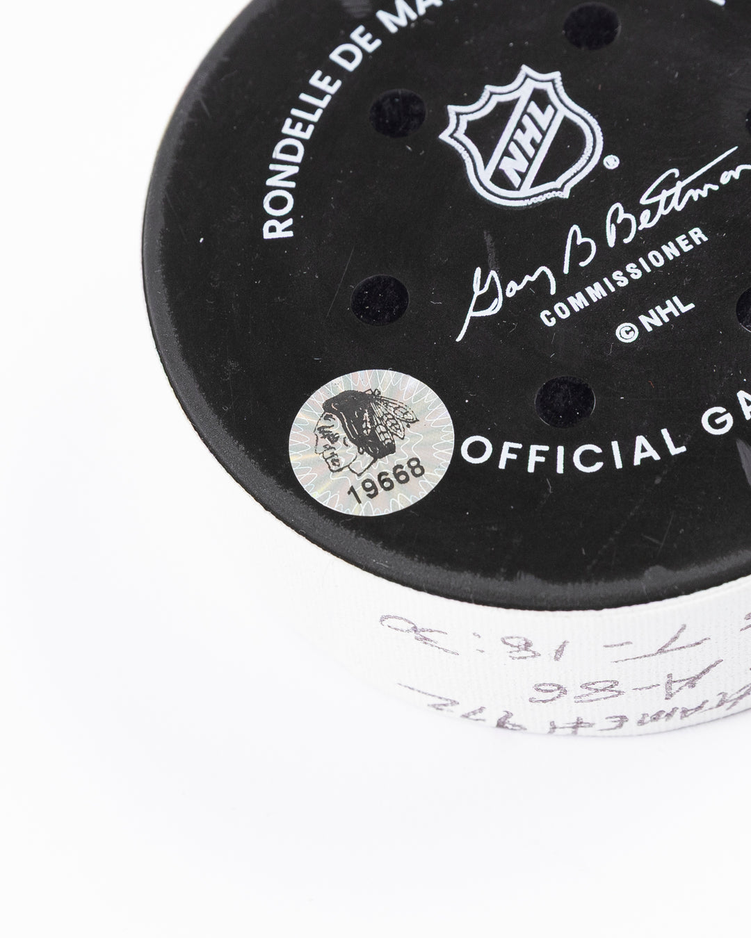 official game used goal puck scored by Chicago Blackhawks player Ryan Donato - hologram sticker detail lay flat