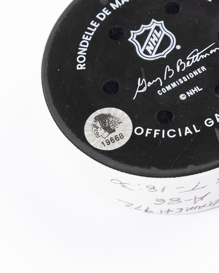 official game used goal puck scored by Chicago Blackhawks player Ryan Donato - hologram sticker detail lay flat