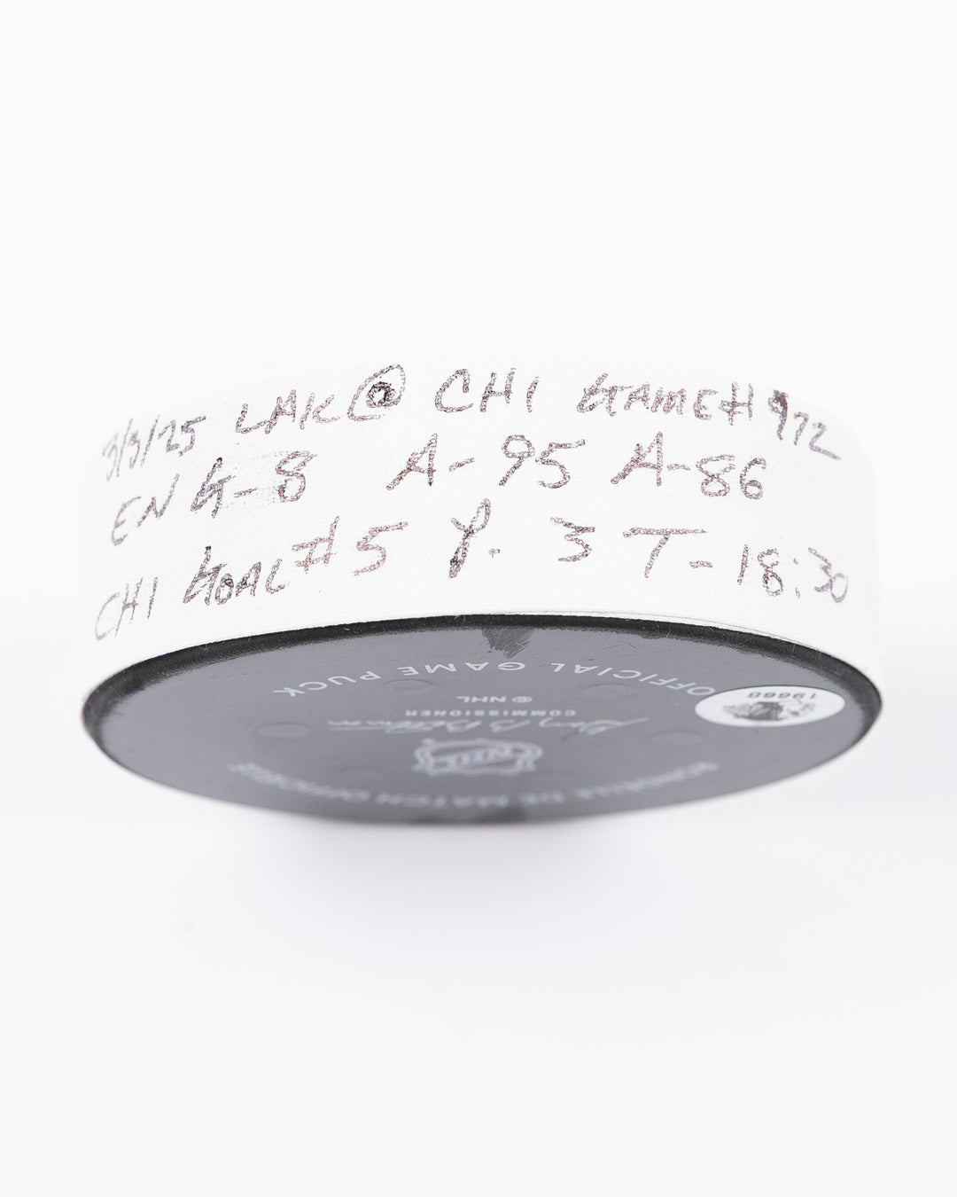 official game used goal puck scored by Chicago Blackhawks player Ryan Donato - tape detail lay flat