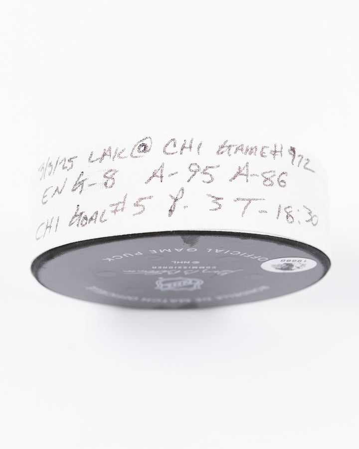 official game used goal puck scored by Chicago Blackhawks player Ryan Donato - tape detail lay flat