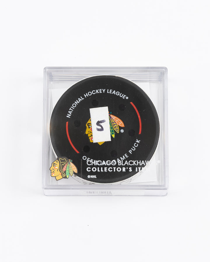 official game used goal hockey puck scored by Chicago Blackhawks player Andreas Athanasiou - front lay flat in case