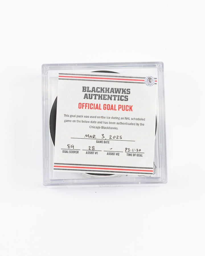 official game used goal hockey puck scored by Chicago Blackhawks player Andreas Athanasiou - front lay flat in case with certificate