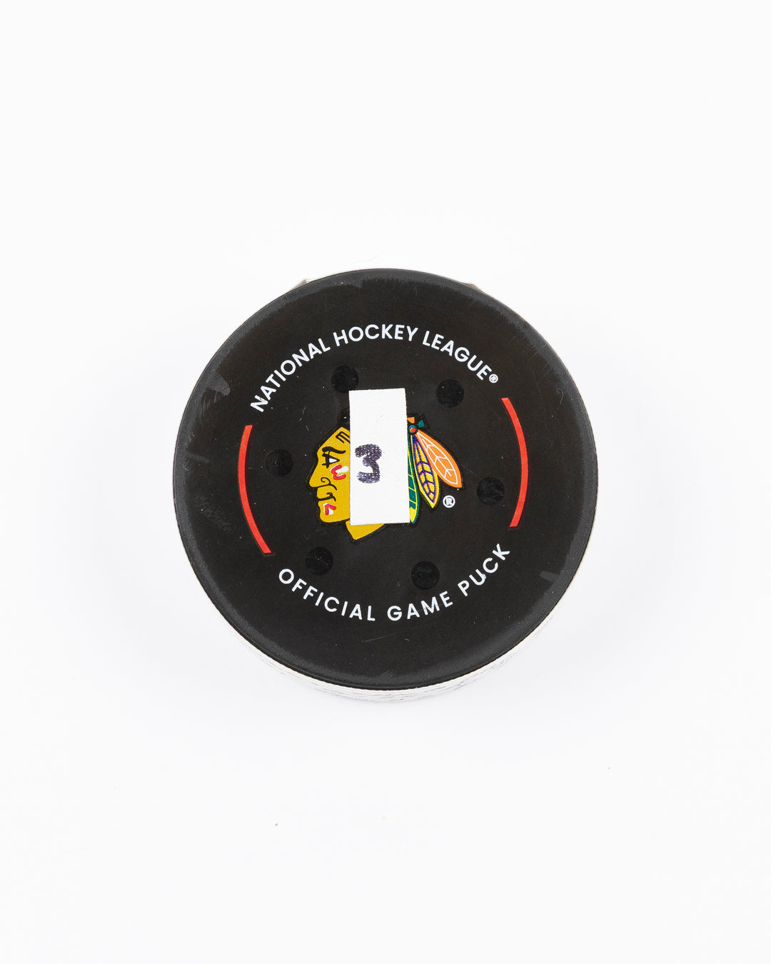 official game used goal puck scored by Chicago Blackhawks player Ilya Mikheyev on 3/3/25 - front lay flat