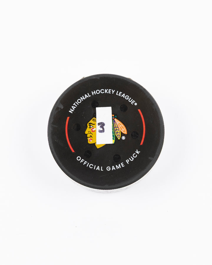 official game used goal puck scored by Chicago Blackhawks player Ilya Mikheyev on 3/3/25 - front lay flat