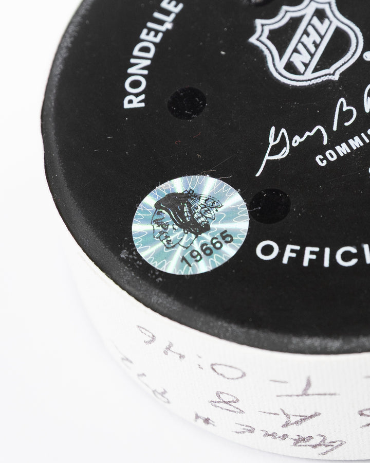 official game used goal puck scored by Chicago Blackhawks player Ilya Mikheyev on 3/3/25 - hologram sticker detail lay flat