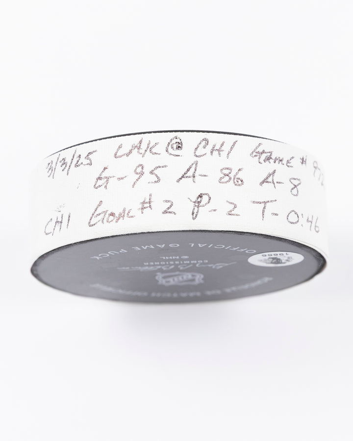 official game used goal puck scored by Chicago Blackhawks player Ilya Mikheyev on 3/3/25 - tape detail lay flat