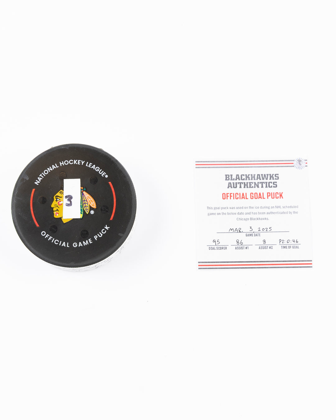 official game used goal puck scored by Chicago Blackhawks player Ilya Mikheyev on 3/3/25 - front lay flat puck and certificate