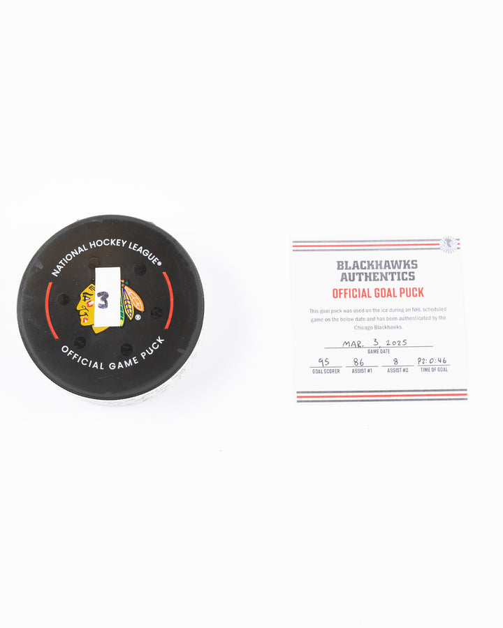 official game used goal puck scored by Chicago Blackhawks player Ilya Mikheyev on 3/3/25 - front lay flat puck and certificate