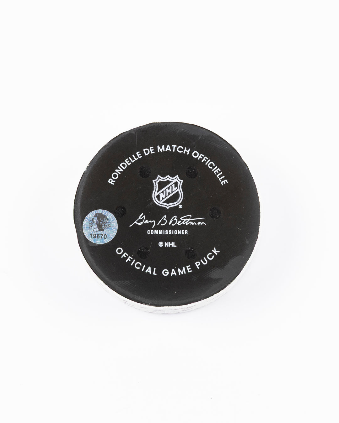official hockey goal puck scored by Chicago Blackhawks plyer Craig Smith against Ottawa Senators 3/5/25 - back lay flat