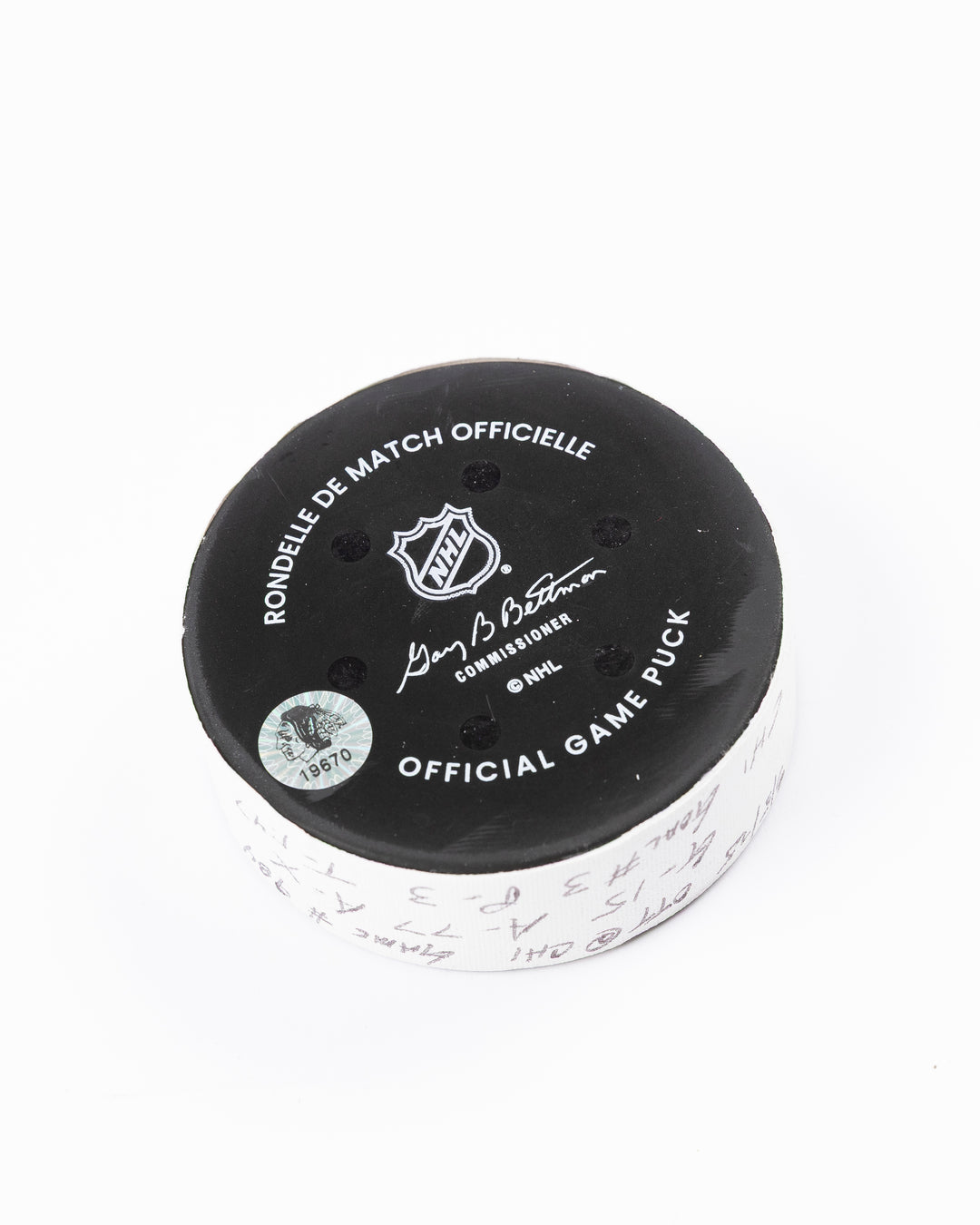 official hockey goal puck scored by Chicago Blackhawks plyer Craig Smith against Ottawa Senators 3/5/25 - back angle lay flat