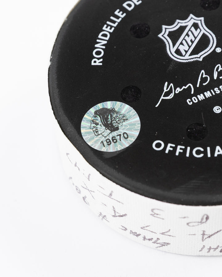 official hockey goal puck scored by Chicago Blackhawks plyer Craig Smith against Ottawa Senators 3/5/25 - hologram sticker detail lay flat