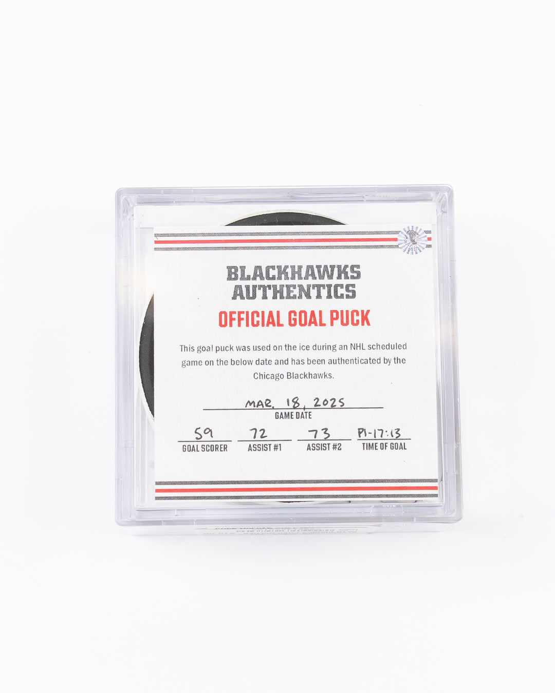 game used hockey goal puck scored by Chicago Blackhawks player Tyler Bertuzzi - front lay flat in case with certificate