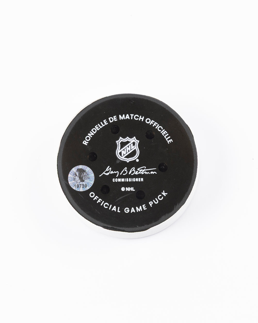 game used hockey goal puck scored by Chicago Blackhawks player Tyler Bertuzzi - back lay flat
