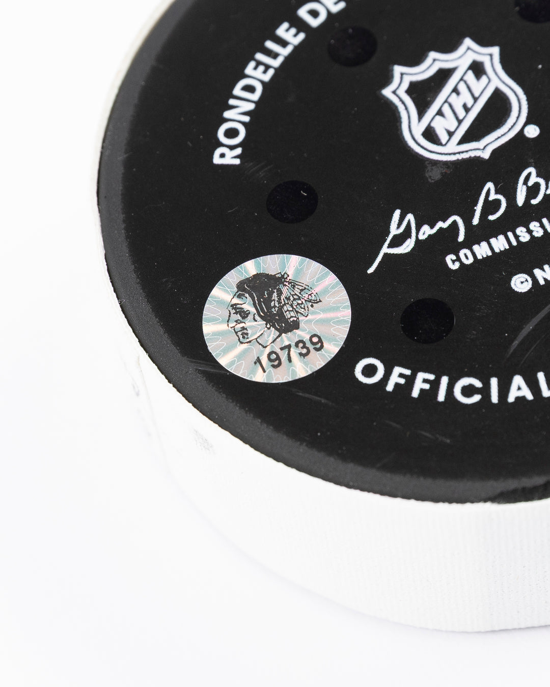 game used hockey goal puck scored by Chicago Blackhawks player Tyler Bertuzzi - hologram sticker detail lay flat