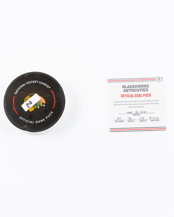 game used hockey goal puck scored by Chicago Blackhawks player Tyler Bertuzzi - front lay flat puck and certificate
