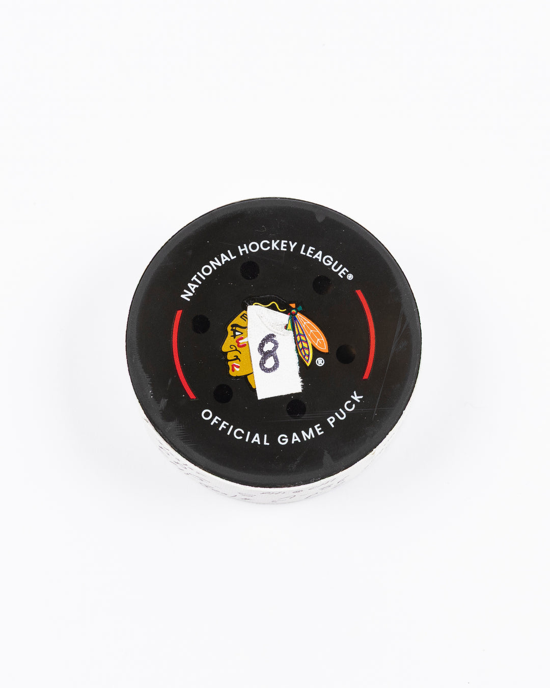 official hockey goal puck scored by Chicago Blackhawks player Ryan Donato 3/23/25 - front lay flat