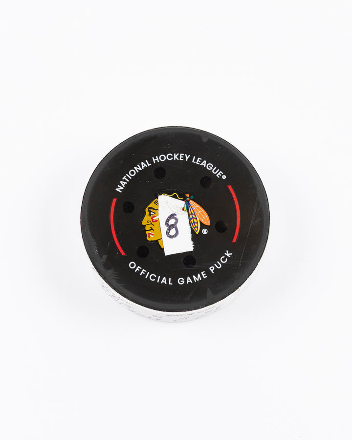 official hockey goal puck scored by Chicago Blackhawks player Ryan Donato 3/23/25 - front lay flat