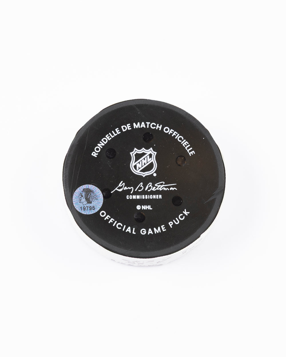official hockey goal puck scored by Chicago Blackhawks player Ryan Donato 3/23/25 - back lay flat