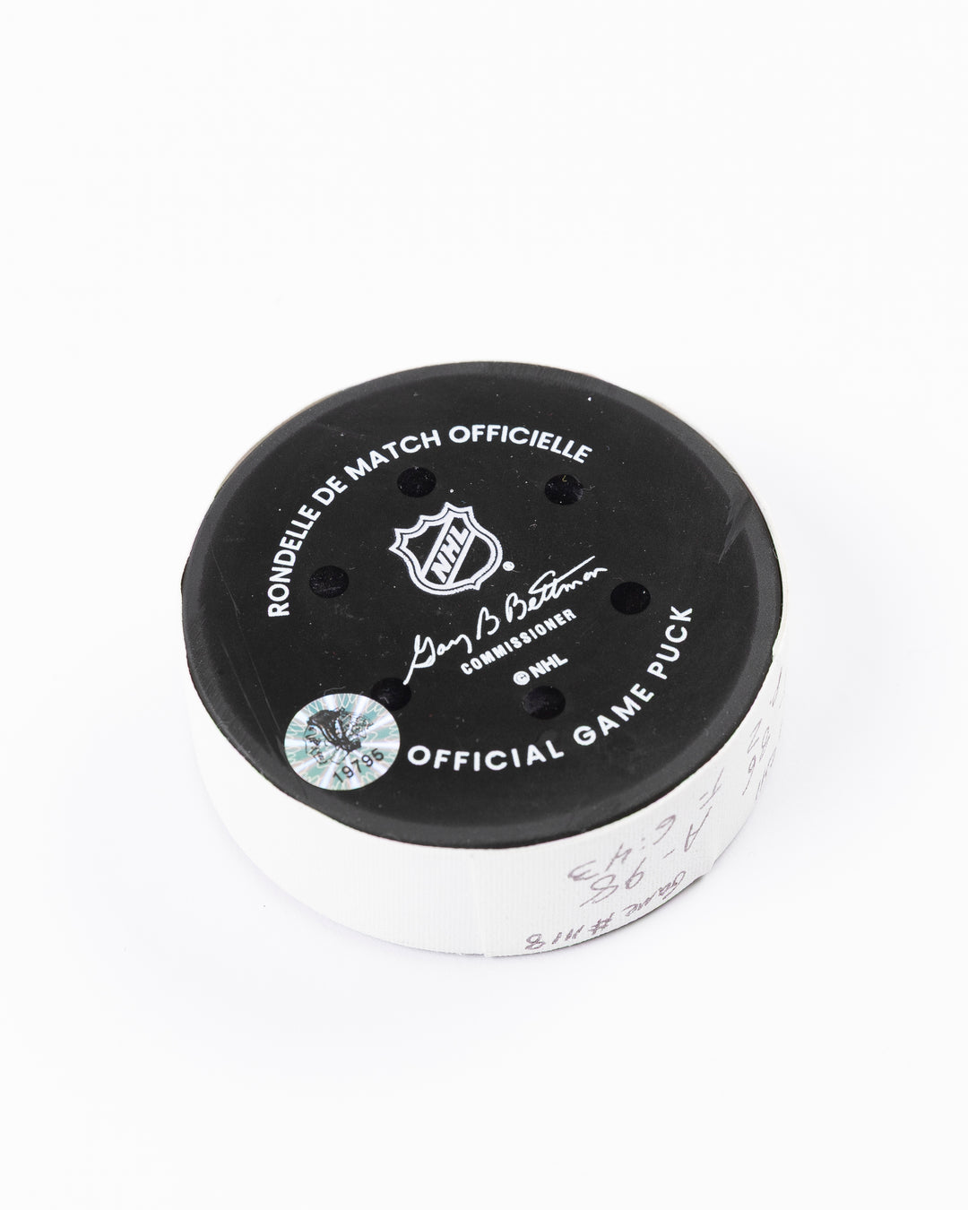 official hockey goal puck scored by Chicago Blackhawks player Ryan Donato 3/23/25 - back angle lay flat