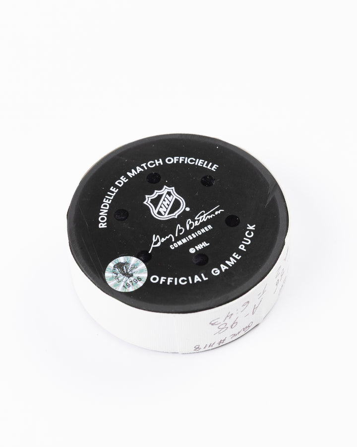 official hockey goal puck scored by Chicago Blackhawks player Ryan Donato 3/23/25 - back angle lay flat