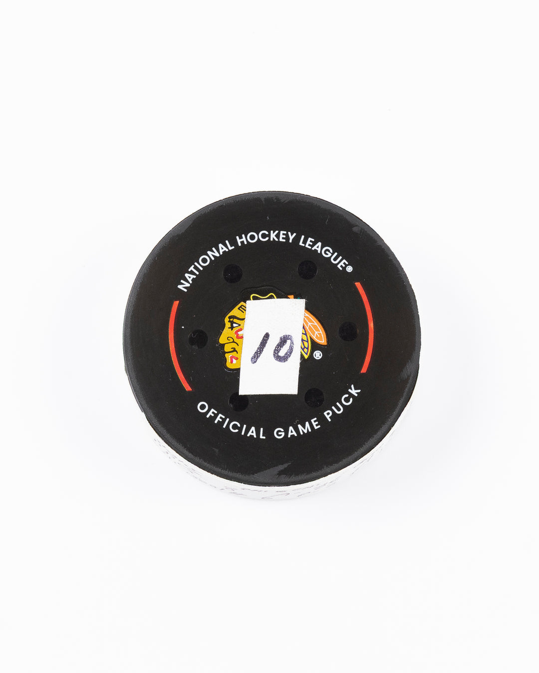 official hockey goal puck scored by Chicago Blackhawks player Ryan Donato on 3/23/25 - front lay flat
