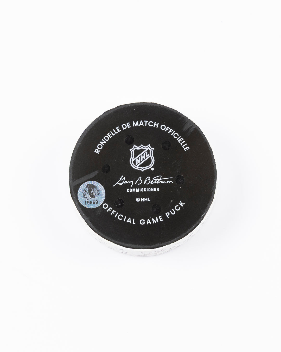 official game used hockey goal puck scored by Chicago Blackhawks player Teuvo Teravainen - back lay flat