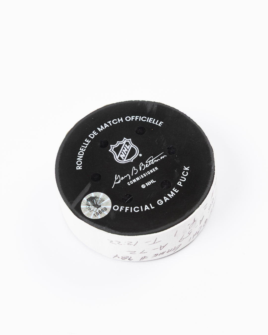 official game used hockey goal puck scored by Chicago Blackhawks player Teuvo Teravainen - back angle lay flat